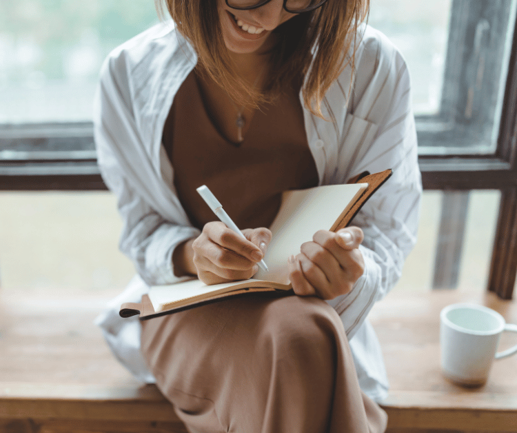 Woman with Best Gratitude Journal