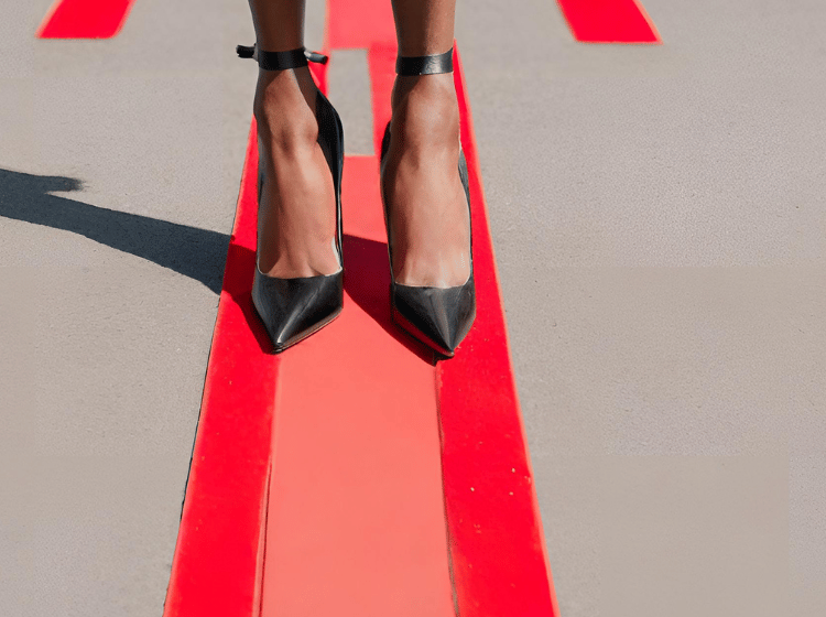 woman in stilettos standing on a line not crossing personal boundaries